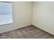 Simple bedroom with neutral walls and carpet at 137 E Douglas Ave, Coolidge, AZ 85128