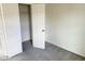 Bright bedroom with neutral carpeting and a closet at 137 E Douglas Ave, Coolidge, AZ 85128