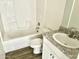Clean bathroom with white tub, vanity, and granite countertop at 137 E Douglas Ave, Coolidge, AZ 85128