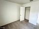 Bright bedroom with neutral carpeting and a closet at 137 E Douglas Ave, Coolidge, AZ 85128
