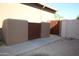 Private side yard access with double wooden gates at 3770 E Colonial Dr, Chandler, AZ 85249