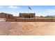 Ranch style home with a large yard and American flag at 48940 W Long Rifle Rd, Aguila, AZ 85320
