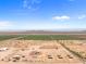 Aerial view showcasing a ranch property with ample land and equestrian facilities at 48940 W Long Rifle Rd, Aguila, AZ 85320
