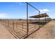 Individual horse stable with covered area and metal fencing at 48940 W Long Rifle Rd, Aguila, AZ 85320