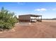 Metal tack room with wooden accents at 48940 W Long Rifle Rd, Aguila, AZ 85320