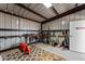 Interior of tack room with saddles and equipment at 48940 W Long Rifle Rd, Aguila, AZ 85320