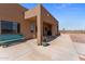 Covered patio with a bench and potted plants at 48940 W Long Rifle Rd, Aguila, AZ 85320