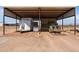Covered area for hay storage with tractor and horse trailer at 48940 W Long Rifle Rd, Aguila, AZ 85320