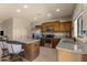 Kitchen boasts granite countertops, stainless steel appliances, and wood cabinets at 48940 W Long Rifle Rd, Aguila, AZ 85320