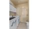 Laundry room with washer, dryer, and cabinets at 48940 W Long Rifle Rd, Aguila, AZ 85320