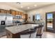 Kitchen features granite countertops, stainless steel appliances, and wood cabinets at 48940 W Long Rifle Rd, Aguila, AZ 85320