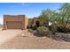One-story stucco home with a two-car garage and desert landscaping at 48940 W Long Rifle Rd, Aguila, AZ 85320