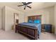 Bright bedroom with large bed and ensuite bathroom access at 48940 W Long Rifle Rd, Aguila, AZ 85320