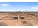 View of a set of covered stables ideal for horse keeping at 48940 W Long Rifle Rd, Aguila, AZ 85320