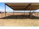 Covered horse stable with a horse inside, providing shade at 48940 W Long Rifle Rd, Aguila, AZ 85320