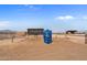 Spacious horse arena with covered seating and surrounding pens at 48940 W Long Rifle Rd, Aguila, AZ 85320