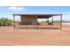 Metal tack room with wooden accents at 48940 W Long Rifle Rd, Aguila, AZ 85320