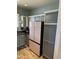 Kitchen features a stylish pink refrigerator and ample gray cabinetry at 18235 N Calacera St, Maricopa, AZ 85138