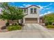 Two-story house with a two-car garage and landscaped front yard at 19778 W Monroe St, Buckeye, AZ 85326