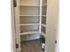 Walk-in pantry with ample shelving for storage at 15963 W Montana De Oro Dr, Surprise, AZ 85387