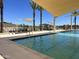 Inviting community pool with shade and seating at 15963 W Montana De Oro Dr, Surprise, AZ 85387