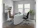 Modern home office with a large desk at 15963 W Montana De Oro Dr, Surprise, AZ 85387