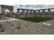 Landscaped community courtyard with pergola and seating at 15963 W Montana De Oro Dr, Surprise, AZ 85387
