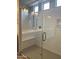 Walk-in shower with glass enclosure and built-in bench at 15963 W Montana De Oro Dr, Surprise, AZ 85387