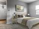 Bright bedroom with ensuite bathroom and neutral decor at 15963 W Montana De Oro Dr, Surprise, AZ 85387