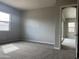Bright bedroom with neutral walls and plush carpeting at 15963 W Montana De Oro Dr, Surprise, AZ 85387