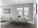 Bright dining room with chandelier, and seating for four at 15963 W Montana De Oro Dr, Surprise, AZ 85387