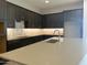 Modern kitchen with stainless steel appliances and large island at 15963 W Montana De Oro Dr, Surprise, AZ 85387