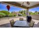 Covered patio with seating area, grill, and view of backyard at 17780 W Canto Bonito Ln, Surprise, AZ 85387
