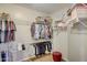 Walk-in closet with ample shelving and hanging space at 17780 W Canto Bonito Ln, Surprise, AZ 85387