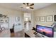 Spacious home office with built-in desk and view into living area at 17780 W Canto Bonito Ln, Surprise, AZ 85387