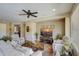 Relaxing living room with comfortable seating and large TV at 17780 W Canto Bonito Ln, Surprise, AZ 85387