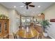 Bright dining area with a round table and a view of the kitchen at 17780 W Canto Bonito Ln, Surprise, AZ 85387
