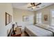 Bedroom with wood floors, chair, and ceiling fan at 17780 W Canto Bonito Ln, Surprise, AZ 85387