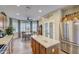 Updated kitchen with island, stainless steel appliances, and a breakfast nook at 17780 W Canto Bonito Ln, Surprise, AZ 85387