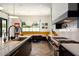 Modern kitchen with dark cabinetry, marble counters, and breakfast nook at 6044 E Calle Del Paisano --, Scottsdale, AZ 85251