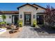Stunning stone and wood exterior with a welcoming front entry at 6044 E Calle Del Paisano --, Scottsdale, AZ 85251