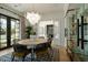 Elegant dining room with a round table, statement chandelier, and wine storage at 6044 E Calle Del Paisano --, Scottsdale, AZ 85251