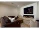 Finished basement with fireplace, large TV, and comfortable seating at 6044 E Calle Del Paisano --, Scottsdale, AZ 85251