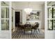 Stylish dining room with a round table and statement chandelier at 6044 E Calle Del Paisano --, Scottsdale, AZ 85251