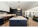 Modern kitchen with dark cabinetry, marble counters, and high-end appliances at 6044 E Calle Del Paisano --, Scottsdale, AZ 85251