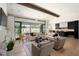 Open concept living area with sliding doors to backyard and pool at 6044 E Calle Del Paisano --, Scottsdale, AZ 85251