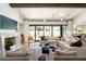 Open living area with a large sectional sofa and a view of the pool at 6044 E Calle Del Paisano --, Scottsdale, AZ 85251