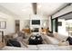 Bright living room with a comfortable sectional sofa and a marble fireplace at 6044 E Calle Del Paisano --, Scottsdale, AZ 85251
