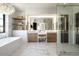 Spa-like bathroom with double vanities, marble floors, and glass shower at 6044 E Calle Del Paisano --, Scottsdale, AZ 85251