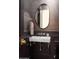 Elegant powder room with marble sink and dark vanity at 6044 E Calle Del Paisano --, Scottsdale, AZ 85251